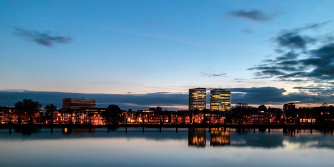 Evening view of the central railway station area with offices in the Dutch city of Arnhem